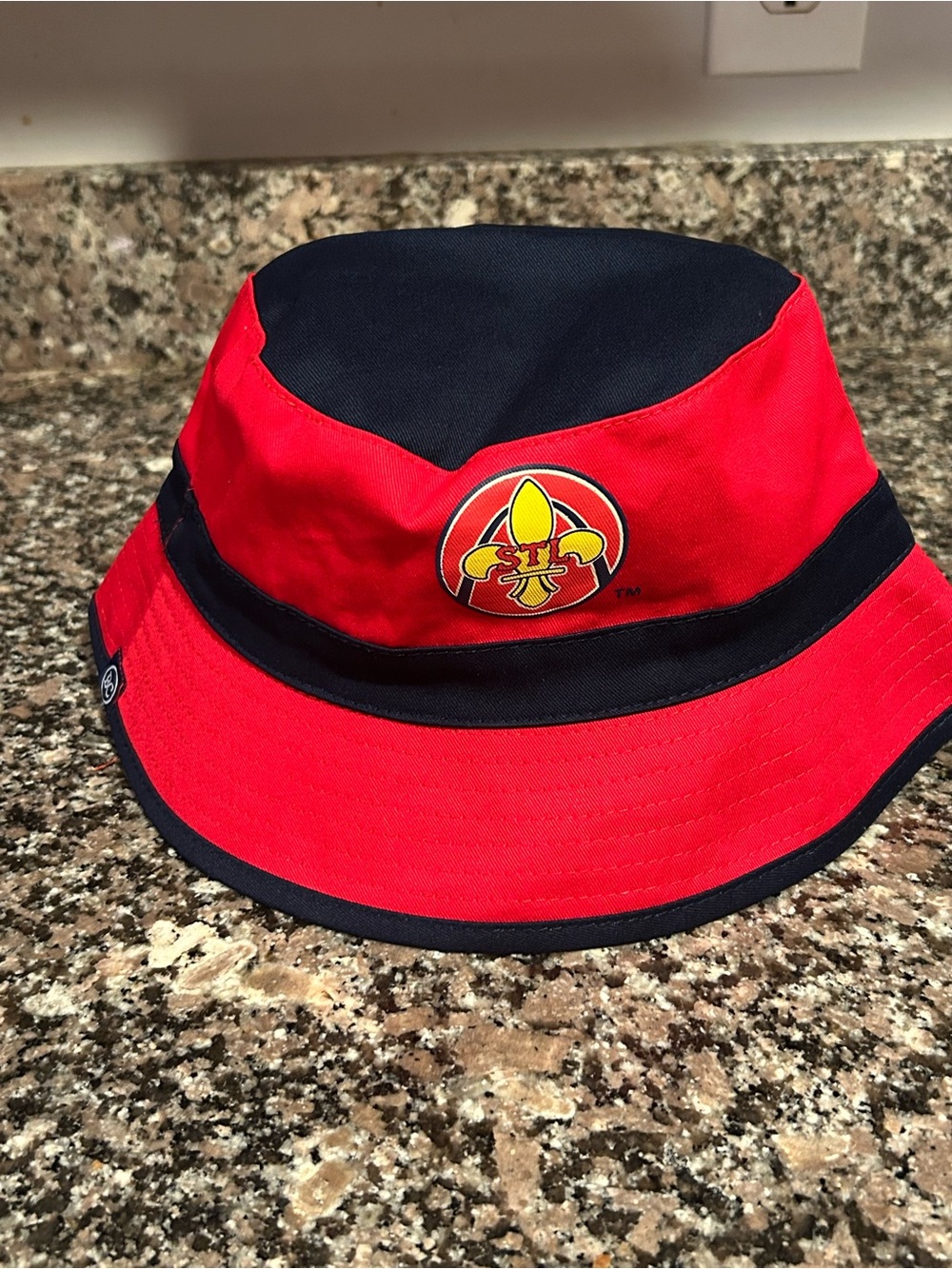 Red and Navy Bucket Hat with Embroidered Fleur-de-Lis Emblem